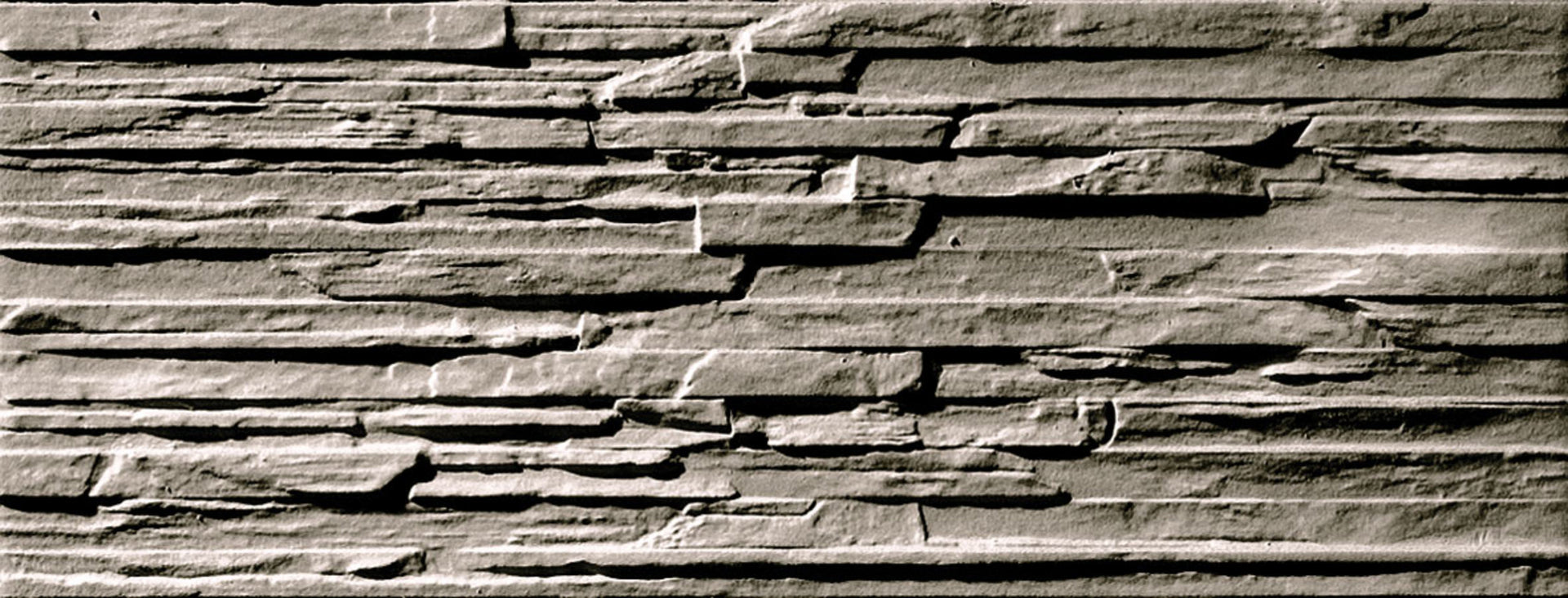 Textured stone effect tile in muretto style